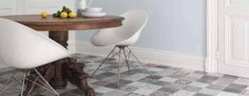 Ein Esszimmer mit einem weißen Tisch und Stühlen. T&K WOHNSTDIO - Raumausstattung, Bodenbeläge, Vinylboden, Parkett, Gardinen - Saarburger Straße 25, 67071 Ludwigshafen